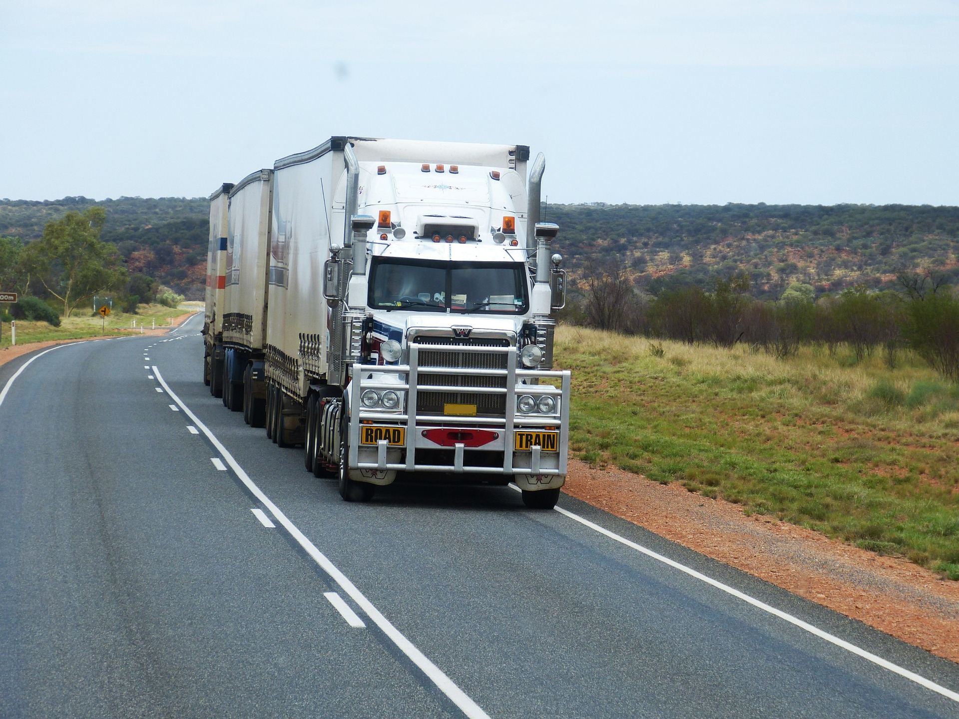 truck driving down country highway
