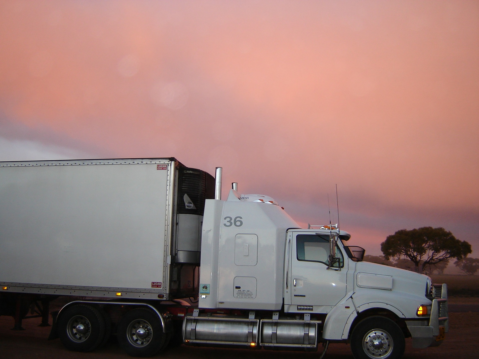 Side view of truck in sunset